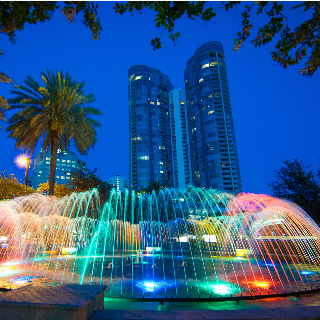 Park with colorful fountains overlooking the twin buildings